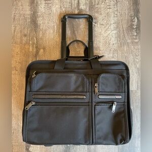 Black Tumi wheeled briefcase/carryon